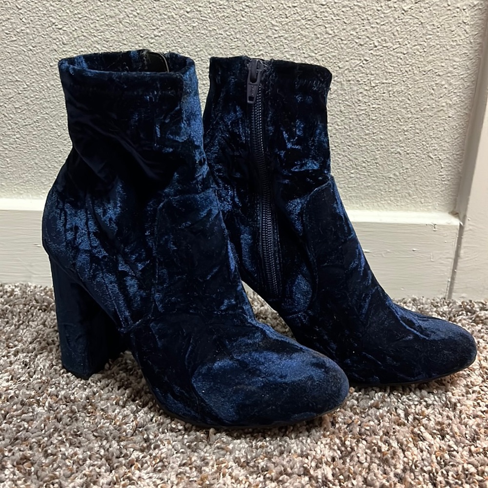 Blue velvet heeled booties.